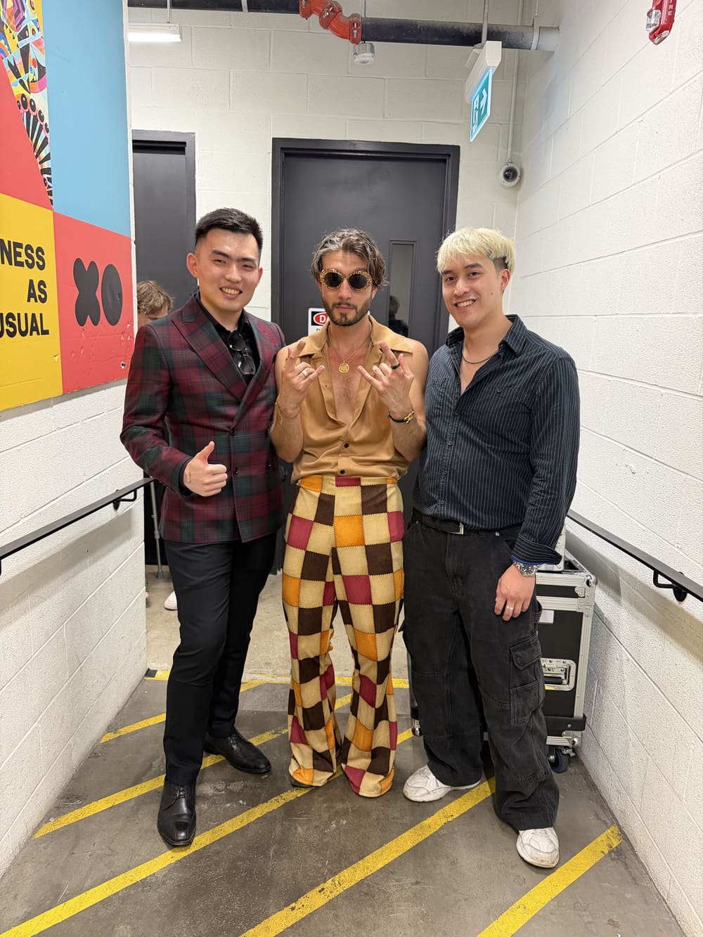 Artistic Director Yuang Chen and Producer Matthew Noah Reyes with bbno$ in a backstage hallway