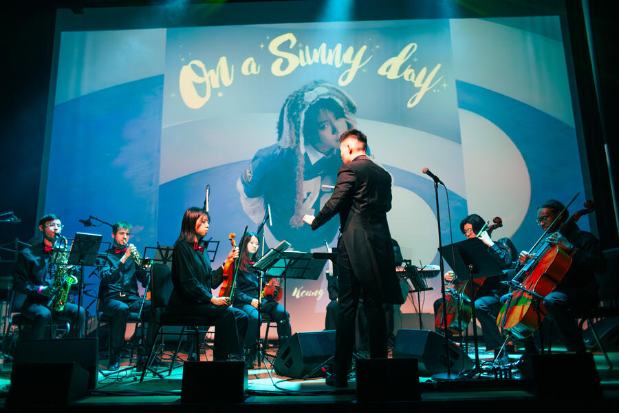 Melodic Eruption, with projections behind the orchestra, March 2026